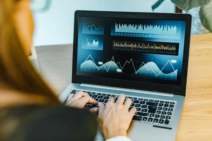 female-trader-typing-on-laptop-2023-11-27-05-08-59-utc
